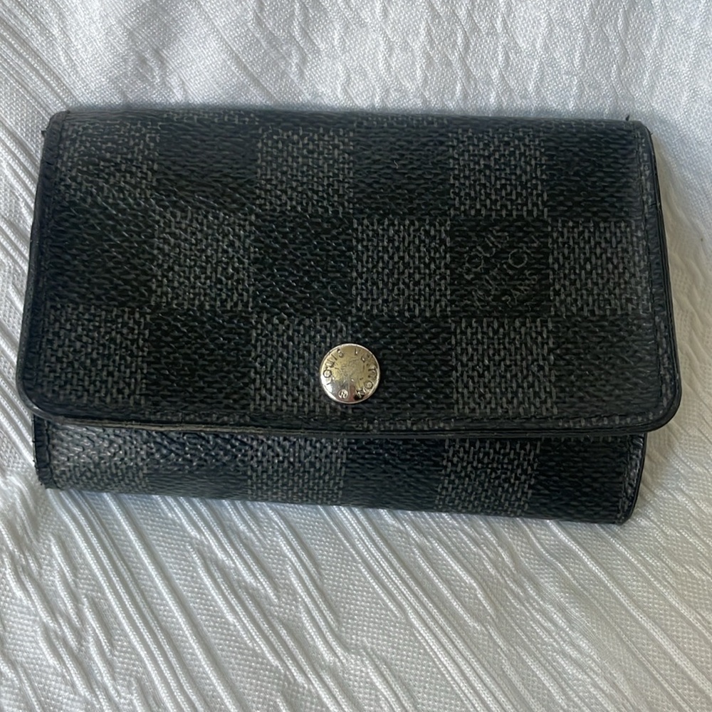 Authentic Louis Vuitton Gray Ebene Leather Key
Holder Wallet